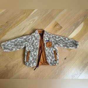 Gently used Sherpa animal print Patagonia in size 12-18 months